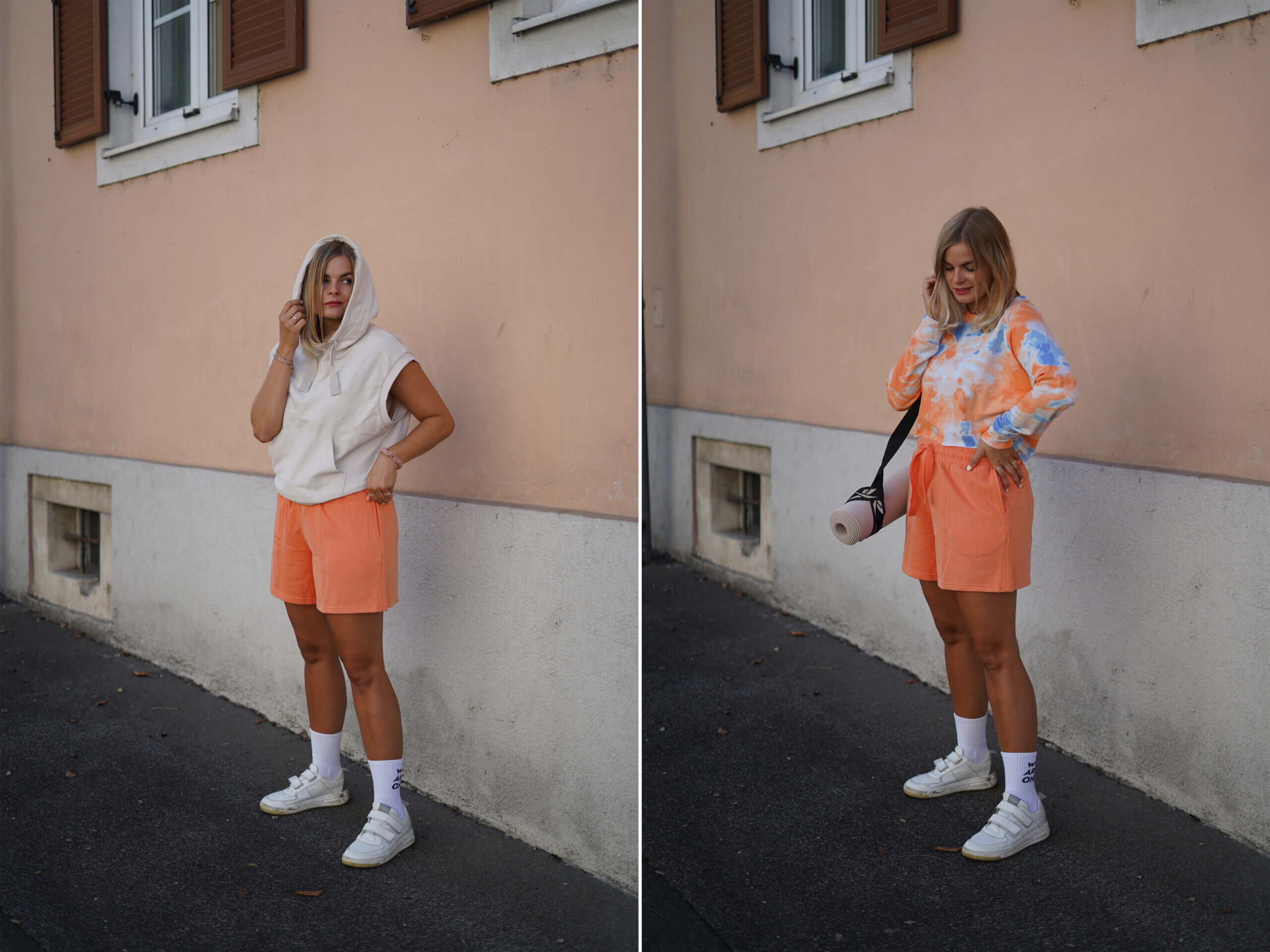 Frau in orangefarbener Shorts vor rosa Wand