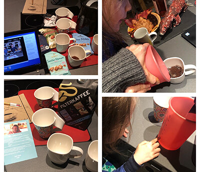 Kind beim Kaffeekochen mit Tassen und Filterkaffee