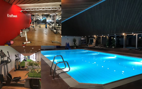 Fitnessstudio mit Geräten und beleuchtetem Innenpool