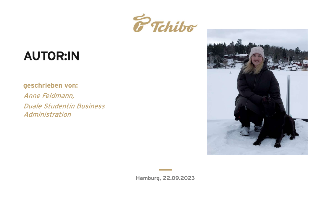 Person mit Hund im Schnee vor zugefrorenem See