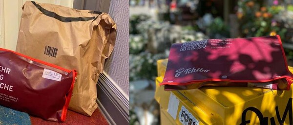 Rote Mehrweg-Tasche neben Papierpaket und auf gelbem Kasten
