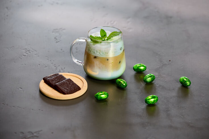 Iced layered latte with mint, chocolate, and candies