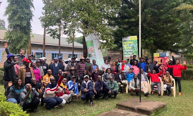 Large group posing outdoors at a community event